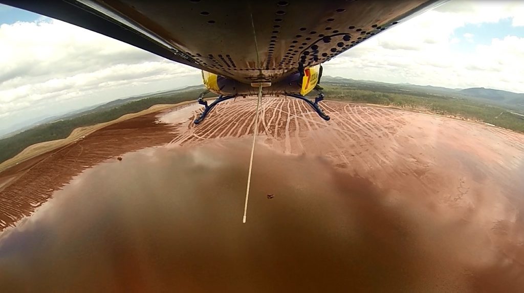 The RACQ Capricorn Helicopter Service was tasked to attend Rio Tinto Yarwun, after two workers were left clinging to a piece of overturned machinery in an the red mud dam (of alumina tailings) for several hours. Rescue 300 winched supplies down to them to sustain them until rescued. Photo Contributed The RACQ Capricorn Helicopter Service was tasked to attend Rio Tinto Yarwun, after two workers were left clinging to a piece of overturned machinery in an the red mud dam (of alumina tailings) for several hours. Rescue 300 winched supplies down to them to sustain them until rescued. Photo Contributed