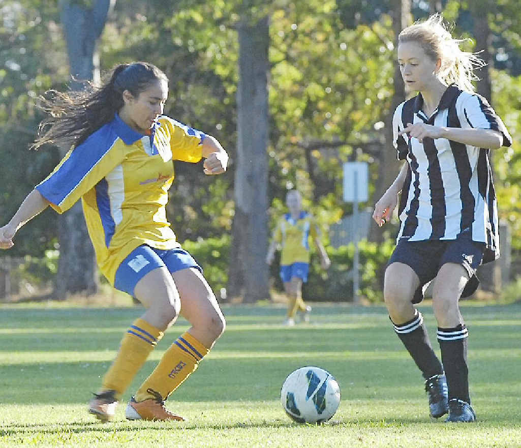 TENSE: Mullumbimby’s Savanah Kennedy (left) and Byron Bay’s Maddison Green challenge for possession during a grade 16 clash at this year’s Oceania Cup. TENSE: Mullumbimby’s Savanah Kennedy (left) and Byron Bay’s Maddison Green challenge for possession during a grade 16 clash at this year’s Oceania Cup.