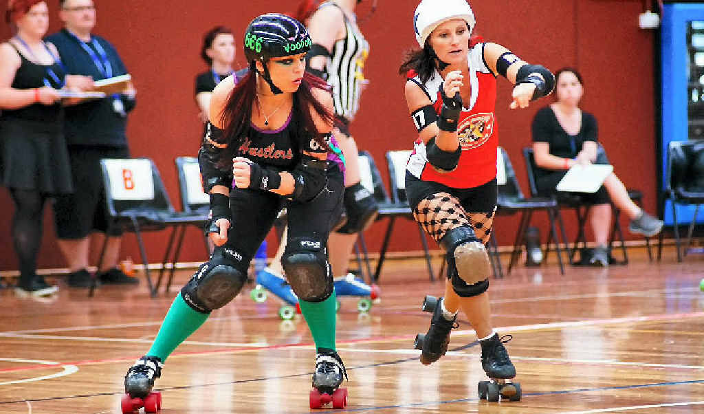 ROUGH ROLLERS: This Harbour City Hustler is about to take out her opponent at the at Tropicarnage, Caboolture. ROUGH ROLLERS: This Harbour City Hustler is about to take out her opponent at the at Tropicarnage, Caboolture.
