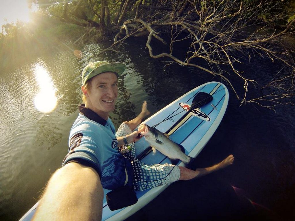 Matt Branthwaite with a big grin landing a Barra from off a Stand up Paddle board in the Boyne this week. Photo Contributed/Matt Branthwaite Matt Branthwaite with a big grin landing a Barra from off a Stand up Paddle board in the Boyne this week. Photo Contributed/Matt Branthwaite