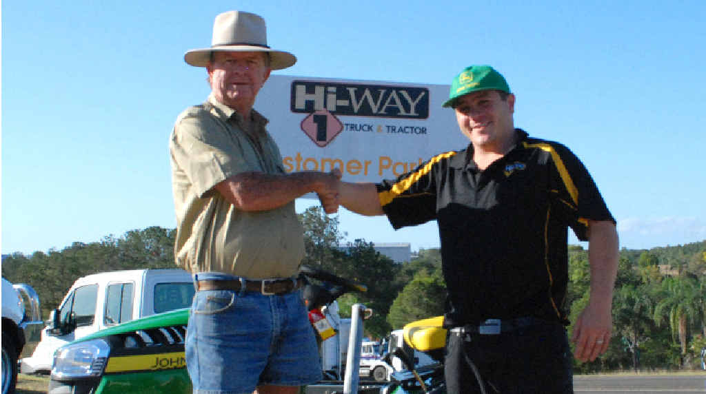 Terry Vollmerhausen receives the keys for his new ride-on lawnmower from Hi-way 1 grounds care specialist John Williams. Terry Vollmerhausen receives the keys for his new ride-on lawnmower from Hi-way 1 grounds care specialist John Williams.