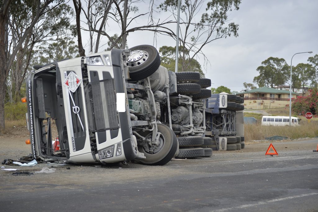 A truck rolled on the corner of Gladstone-Mount Larcom Rd and the Bruce Highway heading into Gladstone on Monday morning. A truck rolled on the corner of Gladstone-Mount Larcom Rd and the Bruce Highway heading into Gladstone on Monday morning.