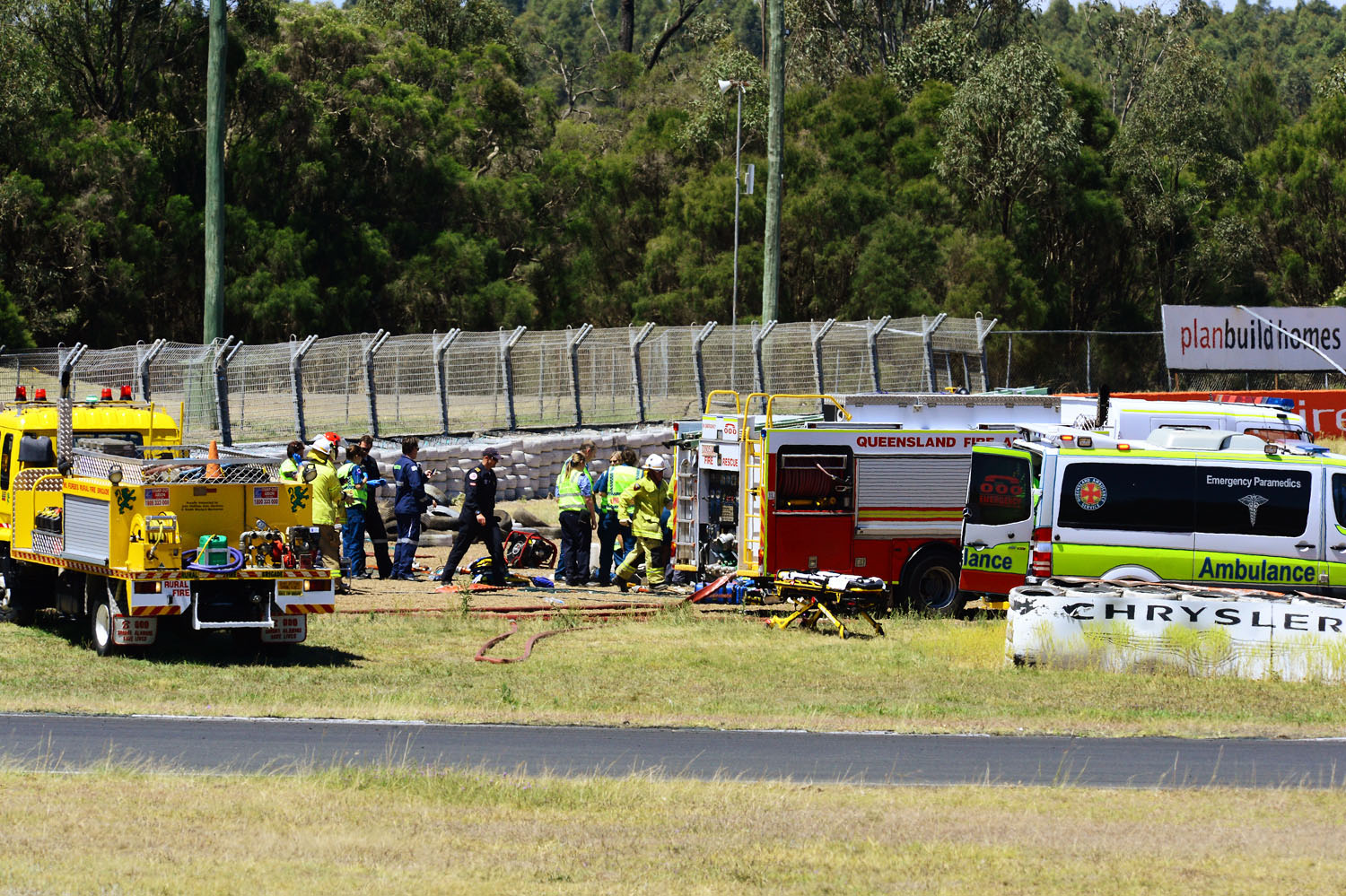 TRACK TRAGEDY: Emergency services workers at the scene of the crash. TRACK TRAGEDY: Emergency services workers at the scene of the crash.