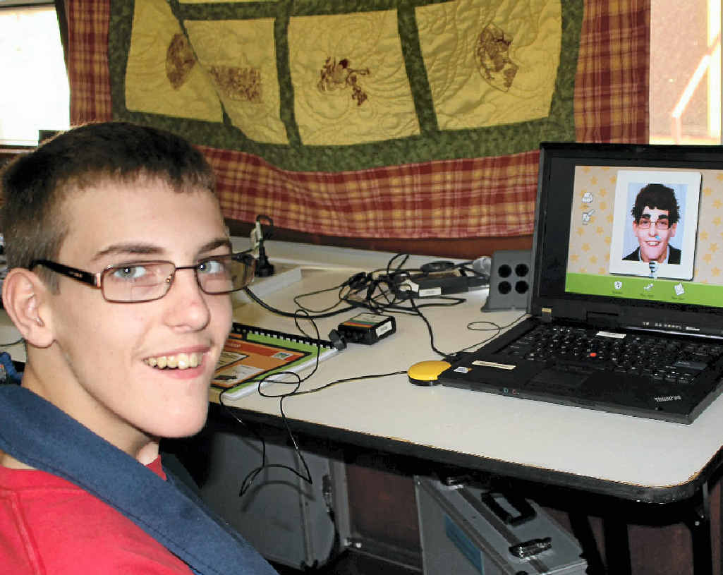 Zac using the computer during Camp Have a Chat to create a design for a shirt. Zac using the computer during Camp Have a Chat to create a design for a shirt.