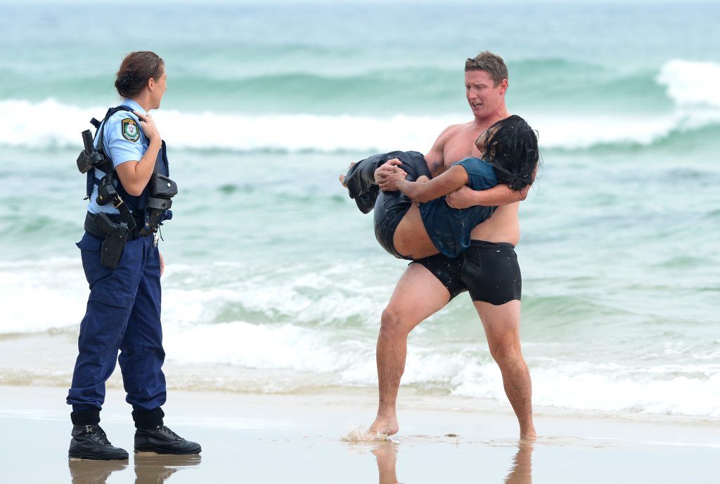 Police save woman from surf at Fingal Heads. Police save woman from surf at Fingal Heads.