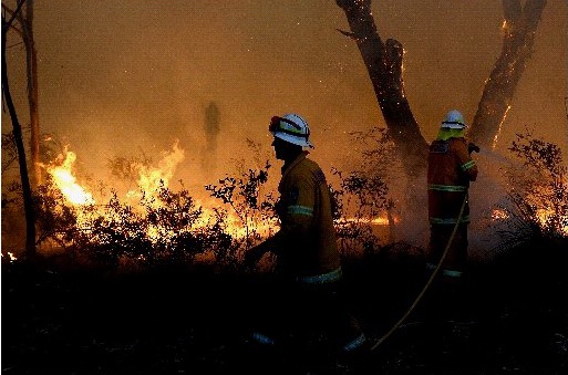Rural Fire Service volunteers retreat after unsuccessfully trying to save a house from a bushfire at Dargan, east north of Lithgow Rural Fire Service volunteers retreat after unsuccessfully trying to save a house from a bushfire at Dargan, east north of Lithgow