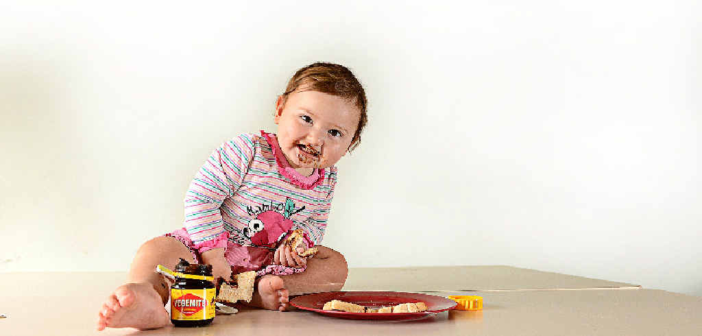 HAPPY LITTLE VEGEMITE: One-year-old Isabella MacMahon of Casino relishes her breakfast. HAPPY LITTLE VEGEMITE: One-year-old Isabella MacMahon of Casino relishes her breakfast.