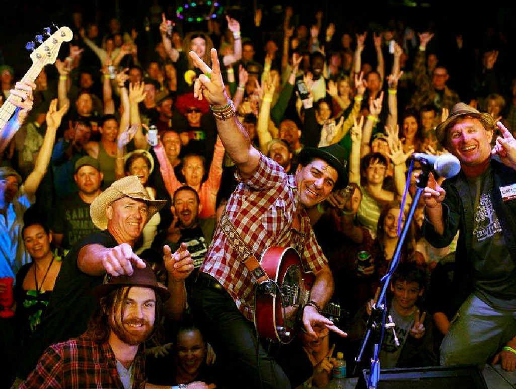 GOOD TIMES ROLL: Artist Nicky Bomba (2nd from right) and loyal festival-goers let loose at Grotto Fest 2012. Grotto Fest 2013 promises to be bigger and better than last year.