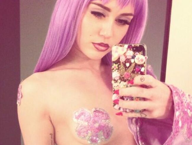Miley Cyrus' raunchy Halloween outfit. Miley Cyrus' raunchy Halloween outfit.