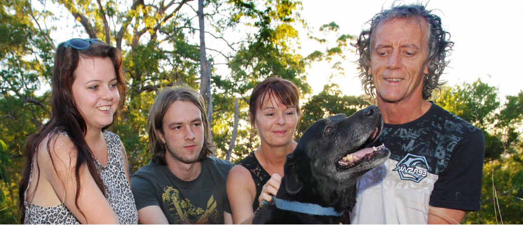 FALLEN: Kerry Johns and his family’s dog Pepsi which was rescued by the fire brigade after falling eight metres on to a ledge during an afternoon walk. Brett Wortman FALLEN: Kerry Johns and his family’s dog Pepsi which was rescued by the fire brigade after falling eight metres on to a ledge during an afternoon walk. Brett Wortman