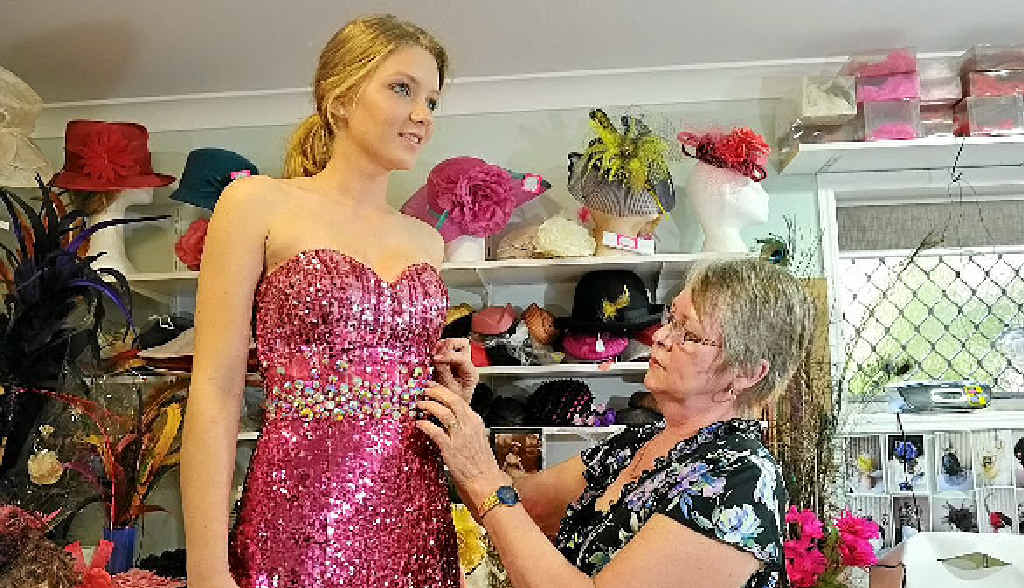 Fillies on Parade seamstress Daphne Pohle works on Chanel College student Beth Jones’s formal dress. Fillies on Parade seamstress Daphne Pohle works on Chanel College student Beth Jones’s formal dress.