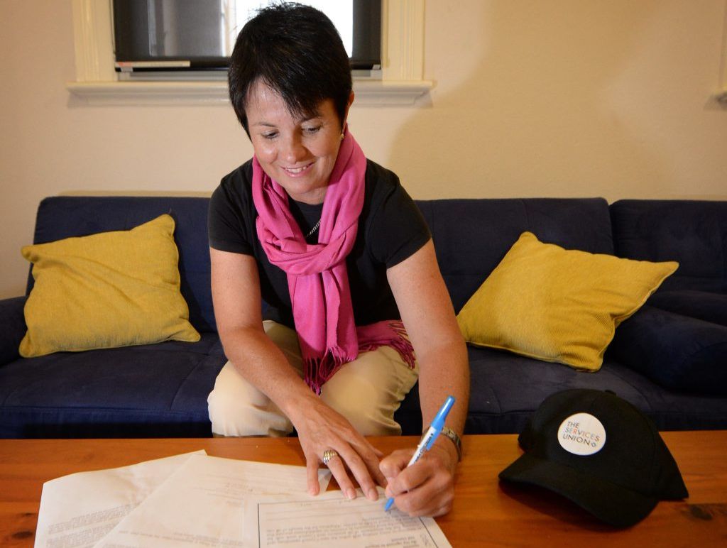 Kay Becker signing a no redundancies pledge for council workers after de-amalgamation. Photo Allan Reinikka / The Morning Bulletin Kay Becker signing a no redundancies pledge for council workers after de-amalgamation. Photo Allan Reinikka / The Morning Bulletin