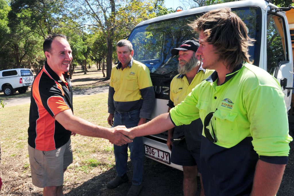 LUCKY RESCUE: Rob Modrow thanks Bundaberg Regional Council Parks and Gardens staff Neil Thomson, Paul Fruscalzo and Dylan Rogers for rescuing his dad from drowning in the Burnett River after his boat capsized. Photo: Max Fleet / NewsMail LUCKY RESCUE: Rob Modrow thanks Bundaberg Regional Council Parks and Gardens staff Neil Thomson, Paul Fruscalzo and Dylan Rogers for rescuing his dad from drowning in the Burnett River after his boat capsized. Photo: Max Fleet / NewsMail