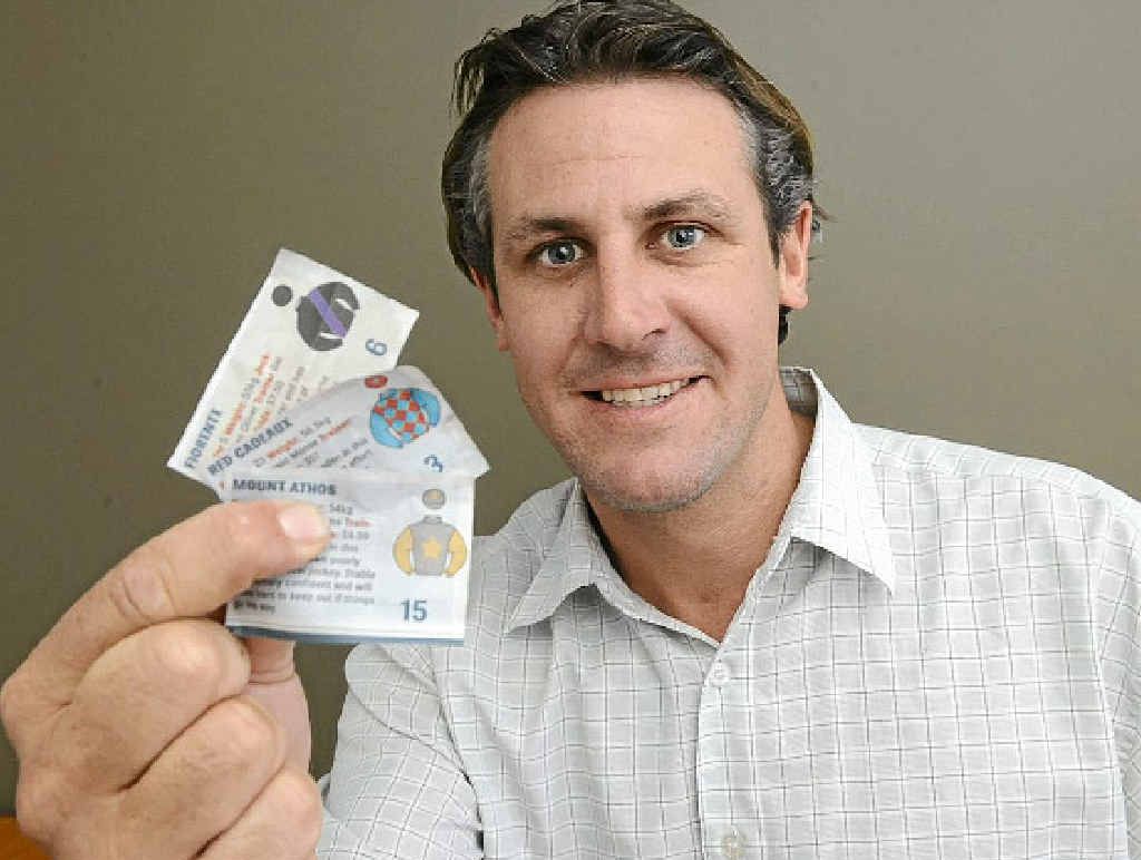 WINNINGS: DEX sports editor Bill North with his winning sweep tickets. PHOTO: ADAM HOURIGAN WINNINGS: DEX sports editor Bill North with his winning sweep tickets. PHOTO: ADAM HOURIGAN