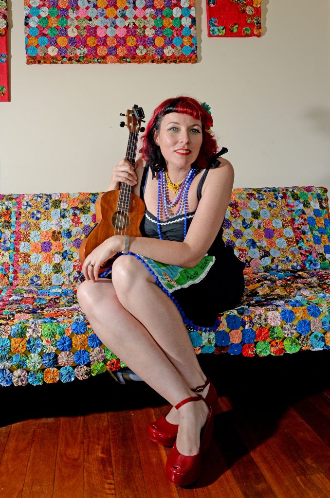 Lil'Fi with some of her artwork at home in Uki.