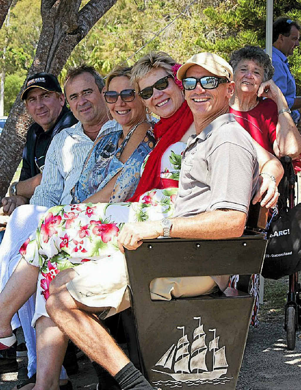 The Mergards at Des’s memorial seat. The Mergards at Des’s memorial seat.