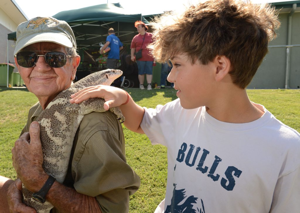 Calum de Mezieres with Bob Irwin and a 4 year old spencers monitor at the annual Scales and Tails Festival at North Ipswich Reserve on Saturday. Photo: Sarah Harvey / The Queensland Times Calum de Mezieres with Bob Irwin and a 4 year old spencers monitor at the annual Scales and Tails Festival at North Ipswich Reserve on Saturday. Photo: Sarah Harvey / The Queensland Times