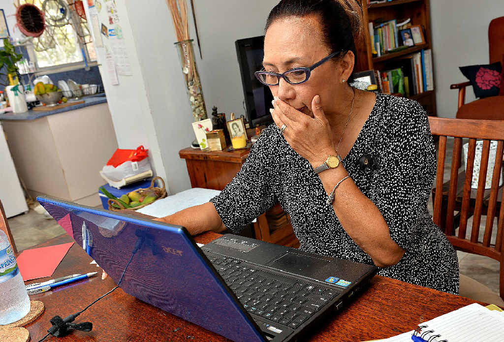 WORRIED: Mackay woman Vivien Hanrahan looks in shock at photos from the Philippines, where her family lives, following a devastating typhoon that has affected about nine million people. WORRIED: Mackay woman Vivien Hanrahan looks in shock at photos from the Philippines, where her family lives, following a devastating typhoon that has affected about nine million people.