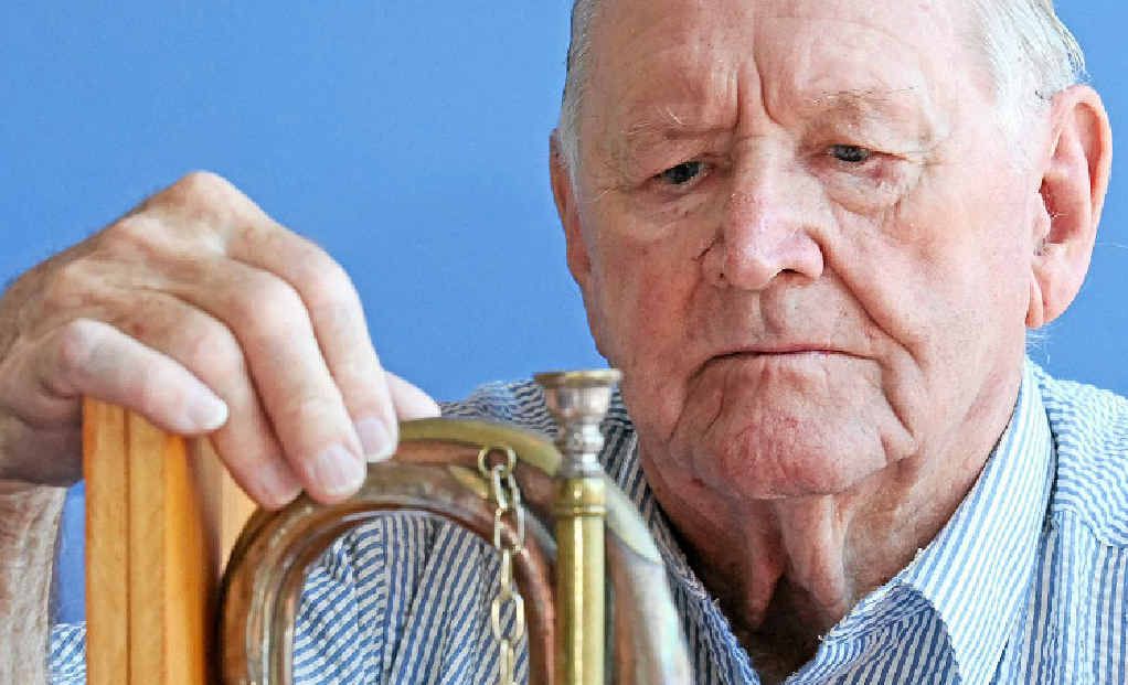 Doug Bellchambers with the bugle he used to play. Doug Bellchambers with the bugle he used to play.