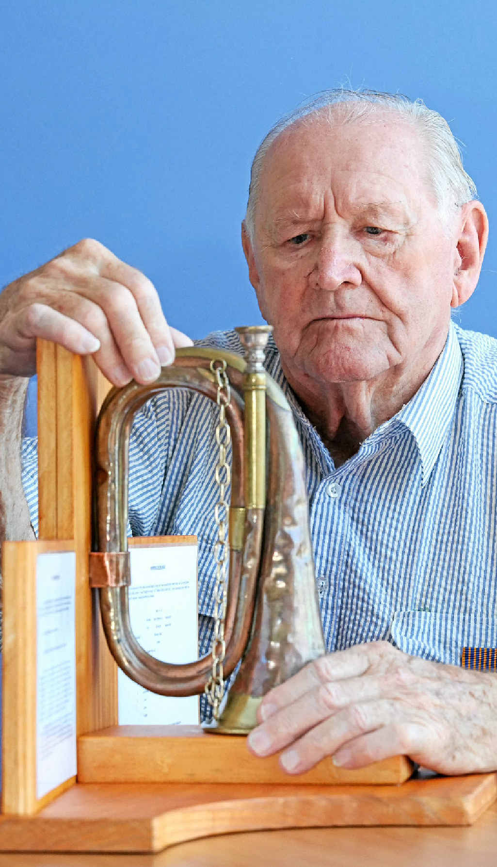 Doug Bellchambers with the bugle he used to play. Doug Bellchambers with the bugle he used to play.