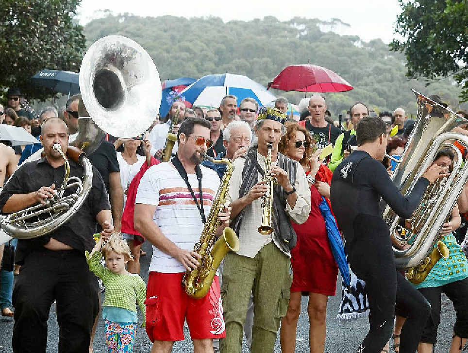 MEMORIAL SERVICE: Byron Bay icon, jazz musician/surfer Dave Ades, was farewelled at The Pass with a service (above) and a paddle out (right) to scatter his ashes. MEMORIAL SERVICE: Byron Bay icon, jazz musician/surfer Dave Ades, was farewelled at The Pass with a service (above) and a paddle out (right) to scatter his ashes.