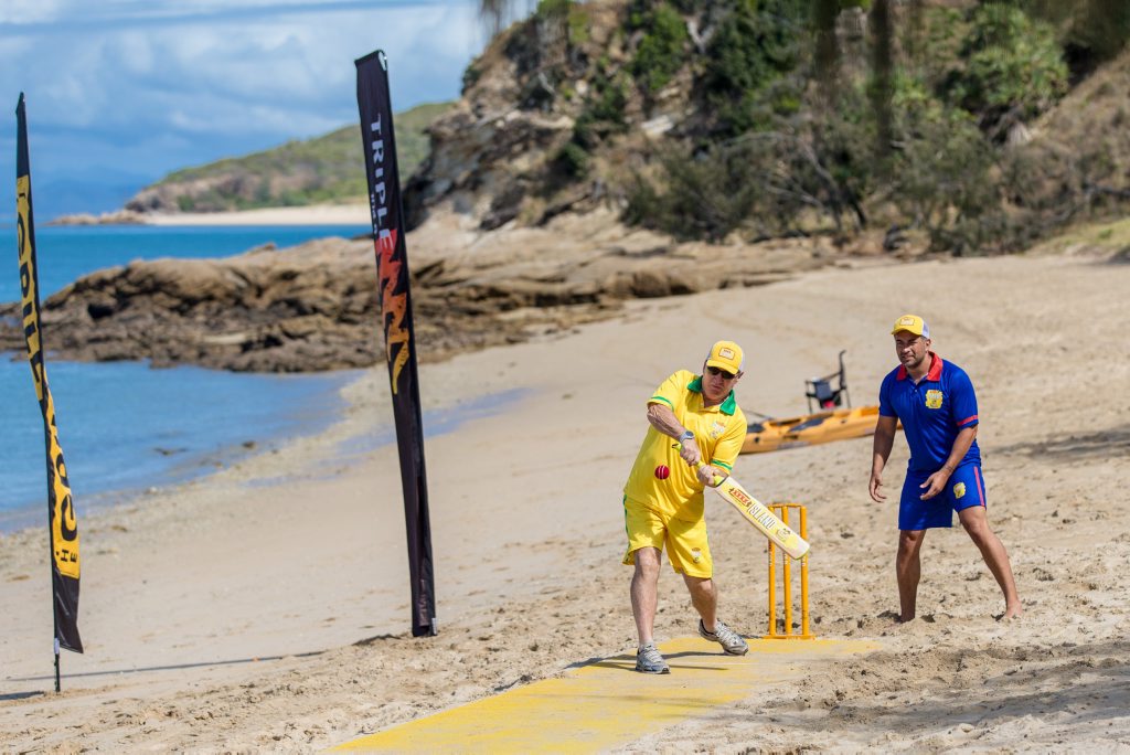 Australian cricket legend Allan Border plays a shot as England captain Adam Hollioake looks on during the XXXX GOLD five-a-side Ashes beach cricket match on XXXX Island. Australian cricket legend Allan Border plays a shot as England captain Adam Hollioake looks on during the XXXX GOLD five-a-side Ashes beach cricket match on XXXX Island.