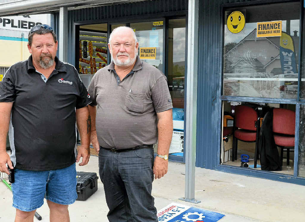 DIRTY WORK: Rickard Motors employee Mark Selfe and owner Jim Rickard found their office had been ransacked on Tuesday night.