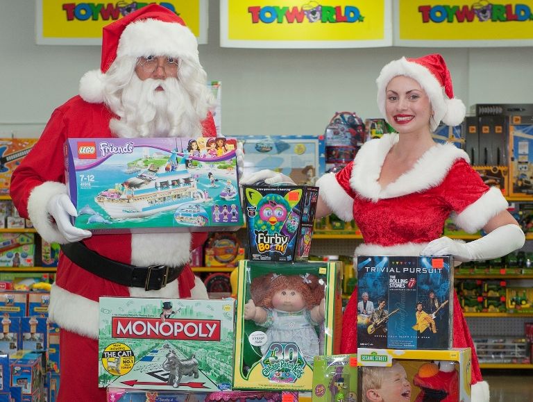 Santa and helper with the top 10 toys of all time, according to a Toyworld survey Santa and helper with the top 10 toys of all time, according to a Toyworld survey
