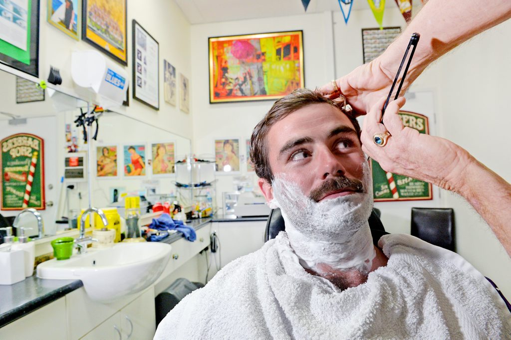 Cabarita Movember participant Mitch Beggs gets a close shave from Tony West at The Barber Shop in Kingscliff. Cabarita Movember participant Mitch Beggs gets a close shave from Tony West at The Barber Shop in Kingscliff.