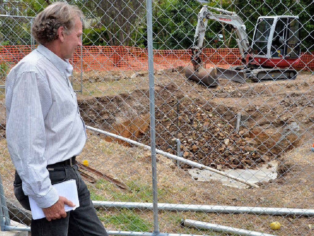 Reporter Arthur Gorrie checks the capping undertaken by the Department of Natural Resources and Mines. Reporter Arthur Gorrie checks the capping undertaken by the Department of Natural Resources and Mines.