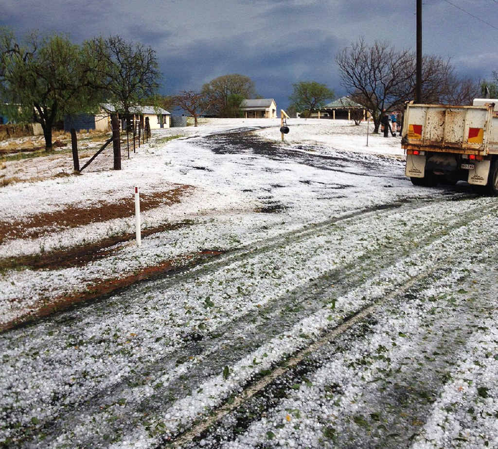STORM SEASON: Hail creates a wintry scene at Woodlands Road in Gatton (above and inset). STORM SEASON: Hail creates a wintry scene at Woodlands Road in Gatton (above and inset).