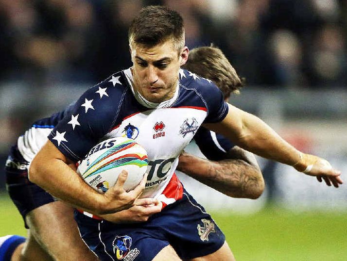 WORLD AWAITS: Ipswich Jets player Michael Garvey breaks a tackle playing for the USA against Scotland at the World Cup. Garvey’s next opponent is Australia. WORLD AWAITS: Ipswich Jets player Michael Garvey breaks a tackle playing for the USA against Scotland at the World Cup. Garvey’s next opponent is Australia.