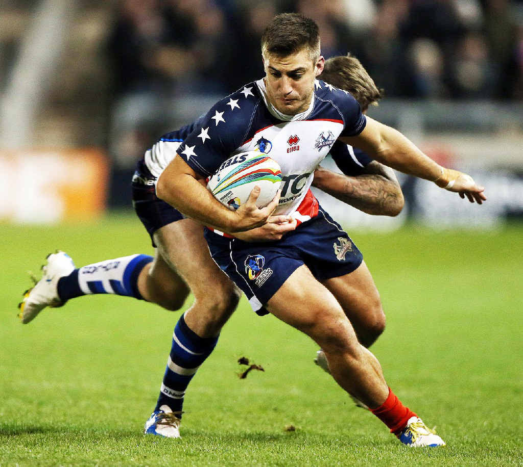 WORLD AWAITS: Ipswich Jets player Michael Garvey breaks a tackle playing for the USA against Scotland at the World Cup. Garvey’s next opponent is Australia. WORLD AWAITS: Ipswich Jets player Michael Garvey breaks a tackle playing for the USA against Scotland at the World Cup. Garvey’s next opponent is Australia.
