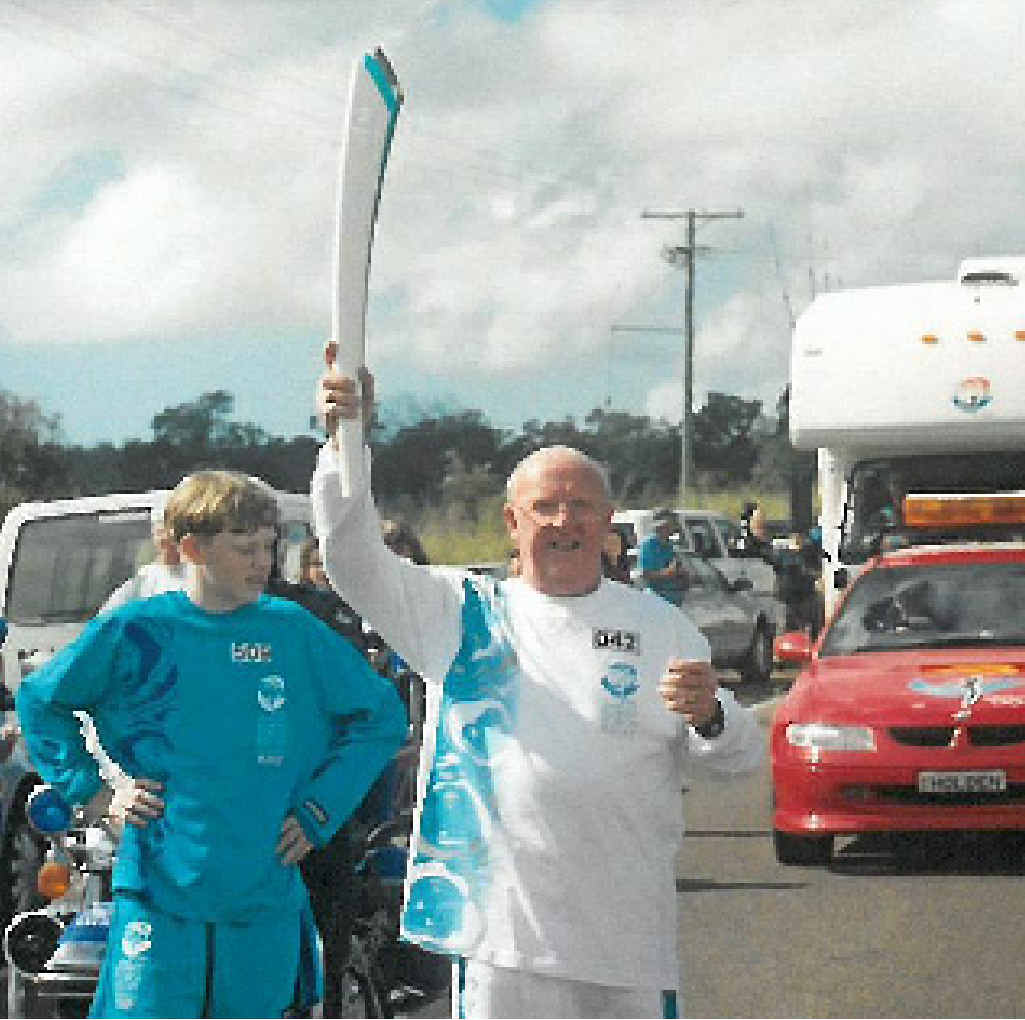 John Rogers, when he carried the torch in the 2000 Olympic torch relay. John Rogers, when he carried the torch in the 2000 Olympic torch relay.