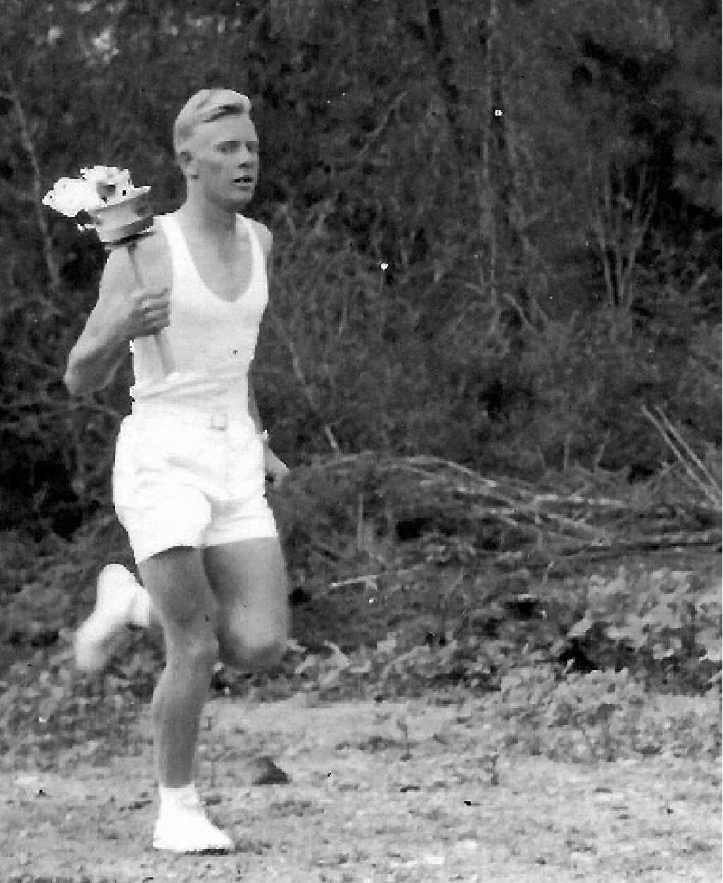 John Bell carries the torch on the stretch from Croydon to Sarina. John Bell carries the torch on the stretch from Croydon to Sarina.