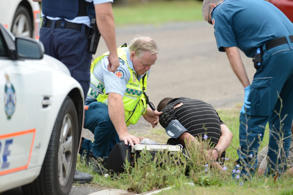 TENSE SCENE: Police lockdown Bruce St, Redbank Plains after reports of a brawl and a gun at a house. TENSE SCENE: Police lockdown Bruce St, Redbank Plains after reports of a brawl and a gun at a house.