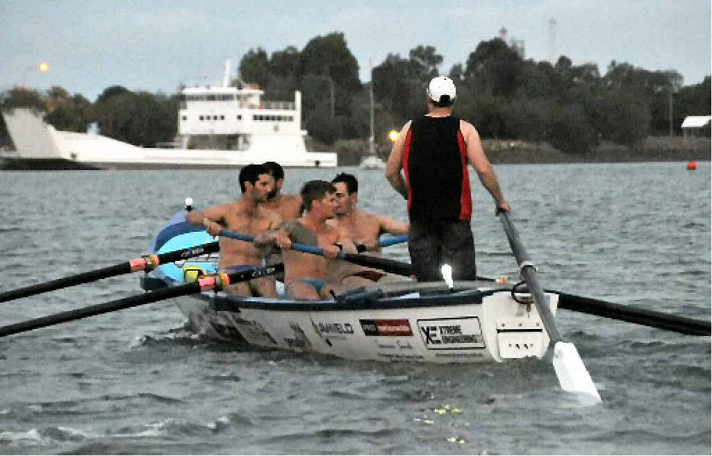 HEAVE HO: Tannum SLSC’s Open Men’s team the ’Hellfish’ row out on a training row as the light fades fast. HEAVE HO: Tannum SLSC’s Open Men’s team the ’Hellfish’ row out on a training row as the light fades fast.