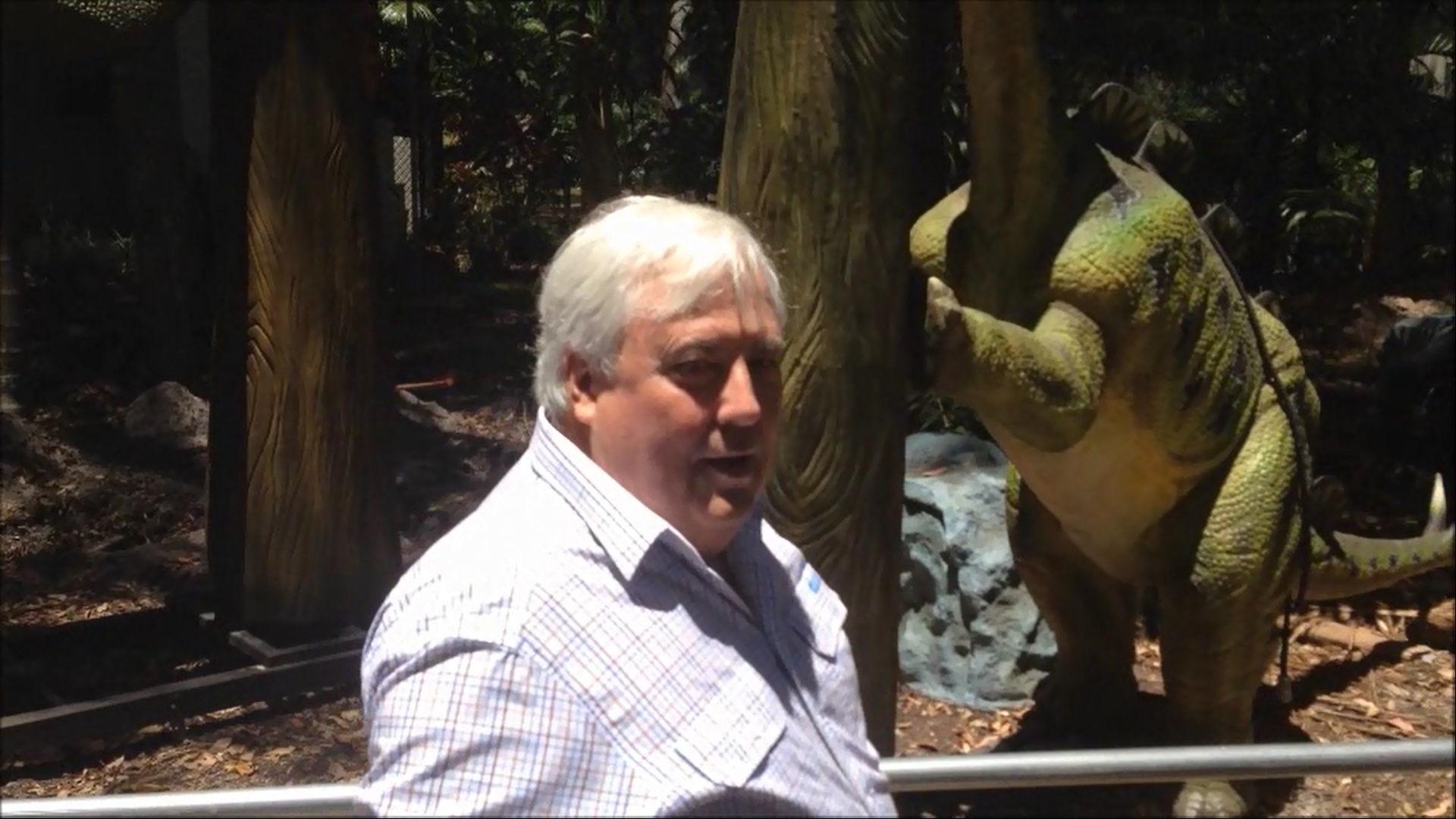 Clive Palmer shows off the Palmersaurus to some reporters. Clive Palmer shows off the Palmersaurus to some reporters.