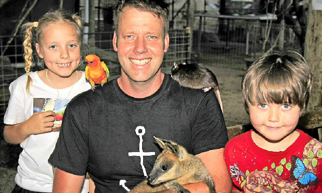 ANIMAL MAD: Childers vet Duncan Smith with daughter Harriet and son Monty, along with Darth Vader the rat, Fatso the corella and Wally the swamp wallaby. ANIMAL MAD: Childers vet Duncan Smith with daughter Harriet and son Monty, along with Darth Vader the rat, Fatso the corella and Wally the swamp wallaby.