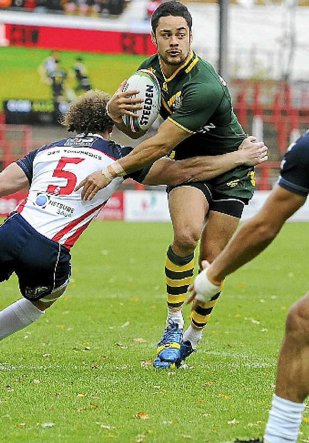 SPOT CEMENTED: Australia’s Jarryd Hayne takes on the tackle of US player Matthew Petersen in their World Cup quarter-final last Saturday. SPOT CEMENTED: Australia’s Jarryd Hayne takes on the tackle of US player Matthew Petersen in their World Cup quarter-final last Saturday.