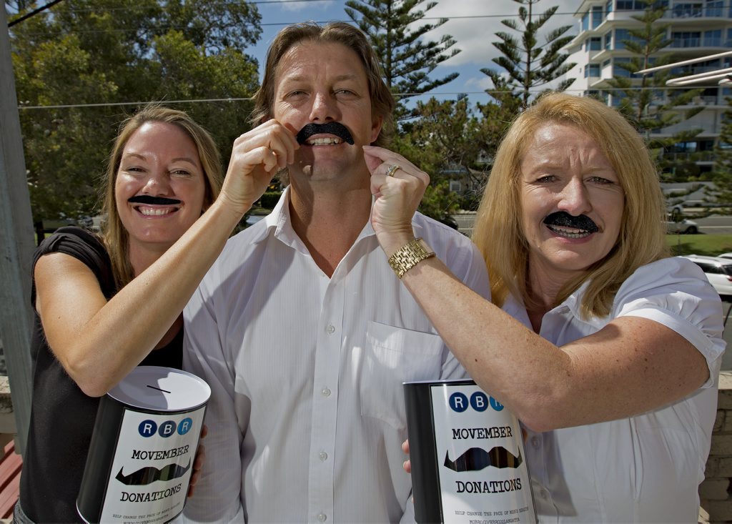 Melissa Young and Angela Molloy with Lenny McLennan of RBR Real Estate are raising money for Movember. Melissa Young and Angela Molloy with Lenny McLennan of RBR Real Estate are raising money for Movember.