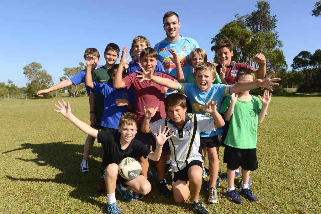 Former Yamba local and Gold Coast Titans player Luke Douglas with local kids at a Titans training session at Angourie Sports Complex. Photo Adam Hourigan / The Daily Examiner Former Yamba local and Gold Coast Titans player Luke Douglas with local kids at a Titans training session at Angourie Sports Complex. Photo Adam Hourigan / The Daily Examiner