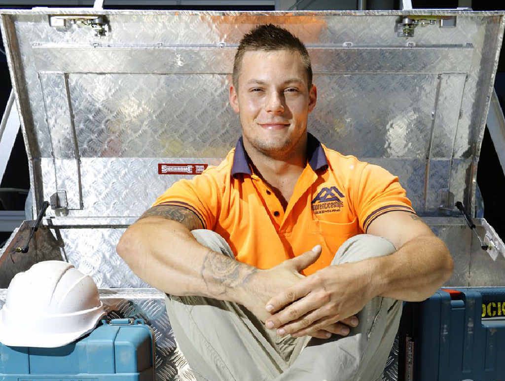 SECURITY FIRST: Apprentice carpenter Adrian Deacon sits next to his tool box in his ute. Mr Deacon is one of many tradies who police are targeting with their Toolbox Secure campaign.