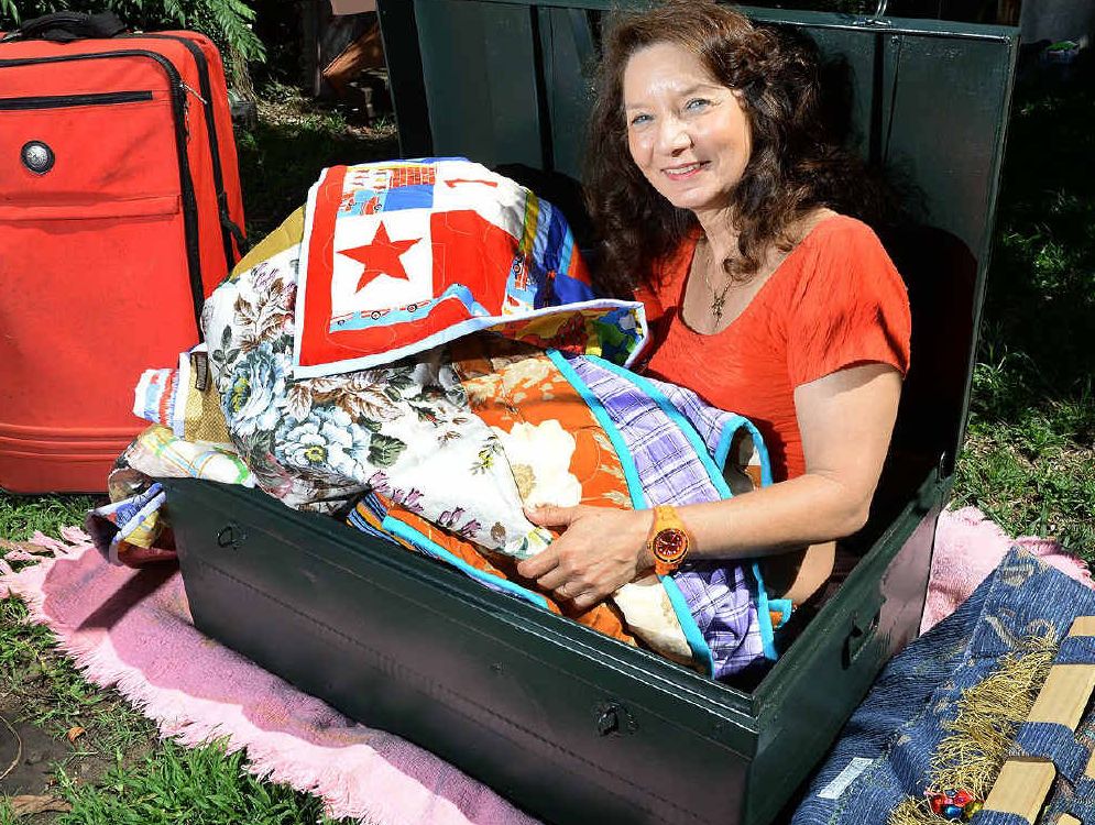 BAG A GREAT BUY: Hedy Keogh promotes the upcoming suitcase rummage event at the Ipswich Masonic Hall.