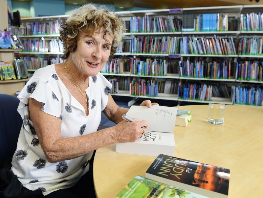 Judy Nunn signs copies of her new book for fans at the Ipswich Library on Thursday.