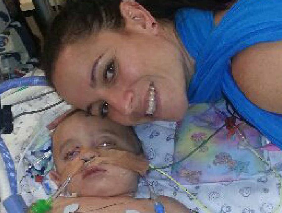 LONG JOURNEY: Sarah Smith comforts her son Finn in Royal Brisbane Hospital. LONG JOURNEY: Sarah Smith comforts her son Finn in Royal Brisbane Hospital.