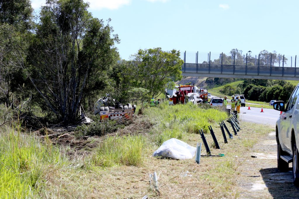Truck rolls off Pacific HWY near Burringbar Creek Bridge. 