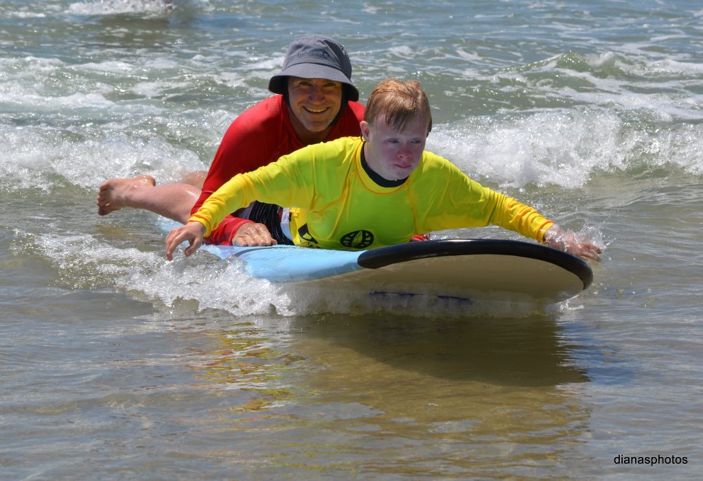 SURFING SMILES: Hannes Walsh getting amongst it with the Disabled Surfers Association Photo Contributed SURFING SMILES: Hannes Walsh getting amongst it with the Disabled Surfers Association Photo Contributed