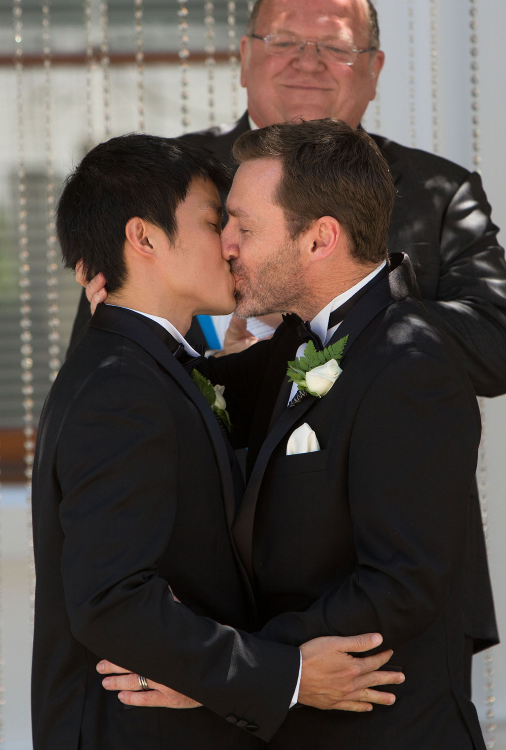 Ivan Hinton (R) and Chris Teoh (L), with marriage celebrant Roger Munson (top-C), are married at Canberra's Old Parliament House on December 7, 2013. Ivan Hinton (R) and Chris Teoh (L), with marriage celebrant Roger Munson (top-C), are married at Canberra's Old Parliament House on December 7, 2013.