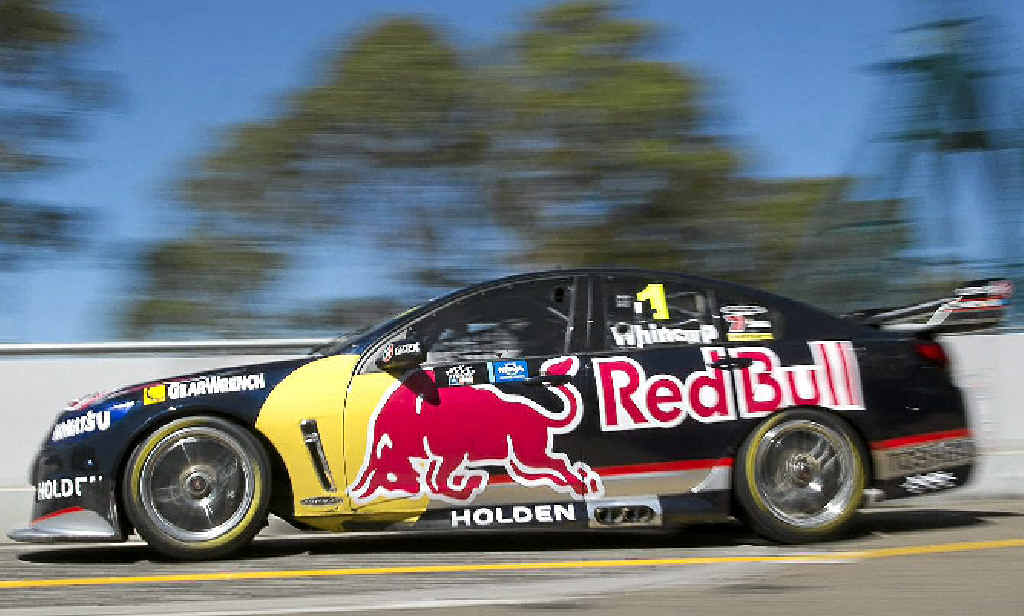 CHARGING BULL: Jamie Whincup (inset, left, with Craig Lowndes) drives his Red Bull Racing Australia Holden during practice at Homebush yesterday. CHARGING BULL: Jamie Whincup (inset, left, with Craig Lowndes) drives his Red Bull Racing Australia Holden during practice at Homebush yesterday.